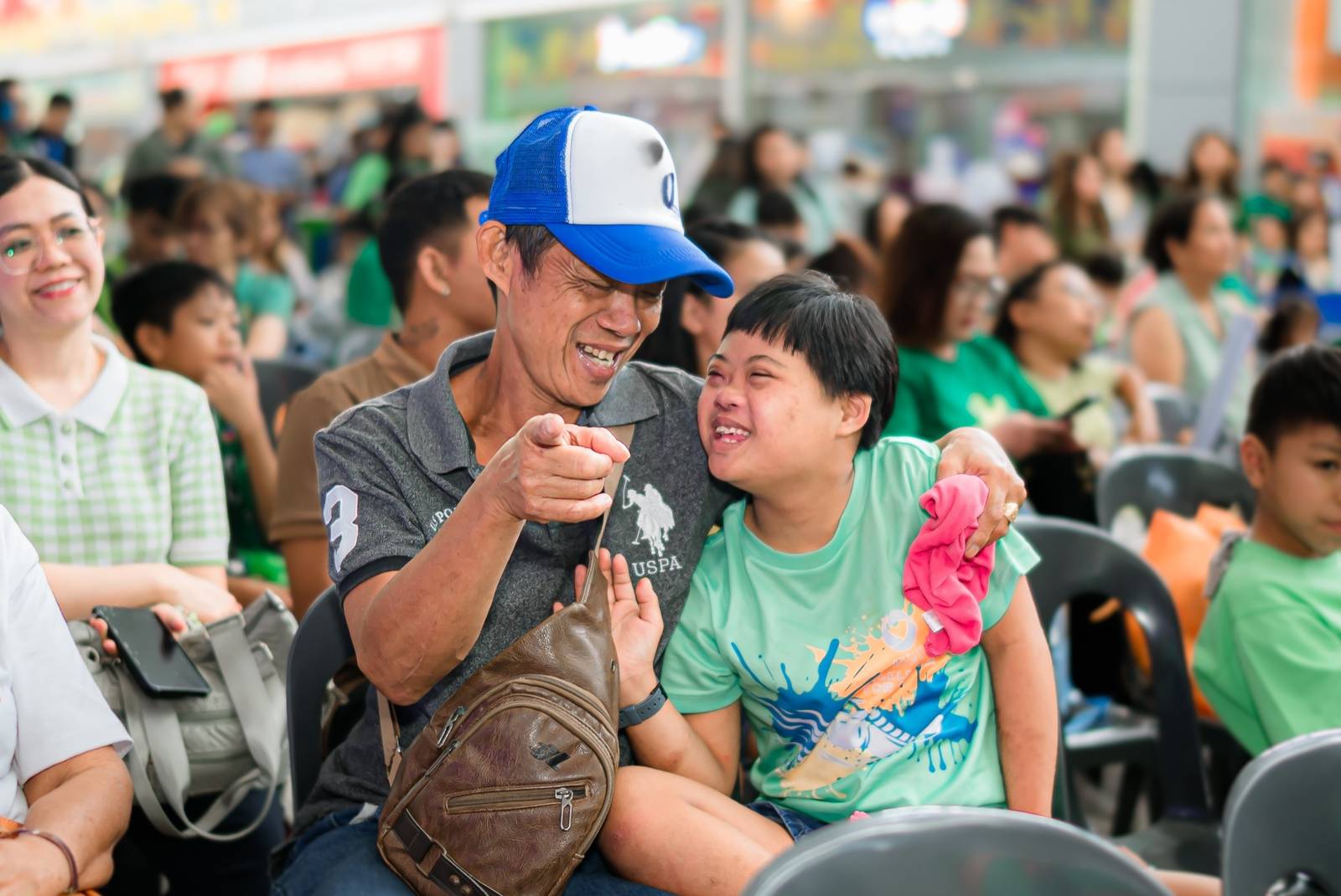 A touching moment between father and son during the ASP Angels Walk — a powerful reminder of the importance of a community embracing neurodiversity.