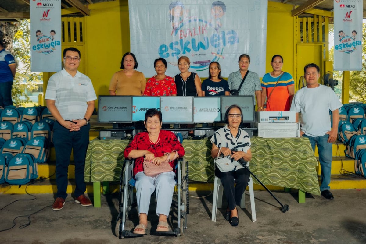 A surprise school reunion. Engr. Ronnie L. Aperocho (leftmost wearing white) was greeted by two of his former teachers and classmates at M. Roxas Elementary School during a Balik Eskwela event with OMF.