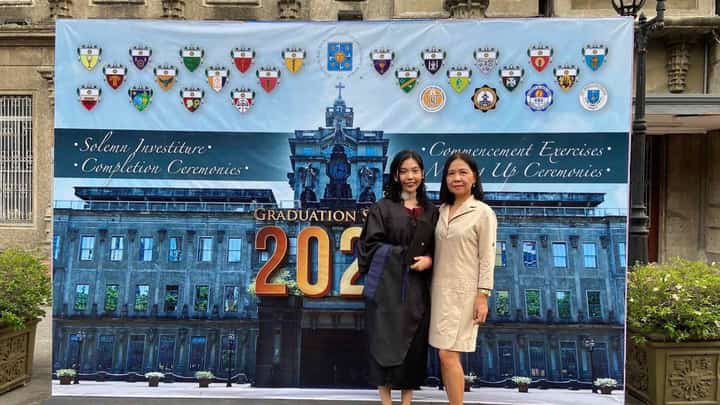The author (left) and her mother (right), Mai, shares a quiet triumph on graduation day.