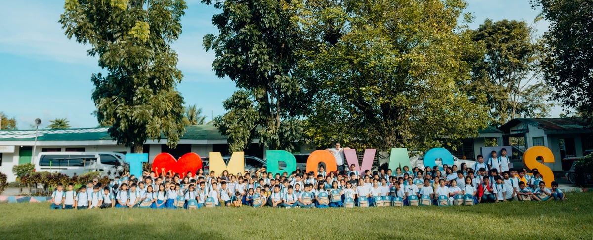 Past meets present. Engr. Ronnie L. Aperocho smiles with the current students of M. Roxas Elementary School, where he spent his childhood as a student.