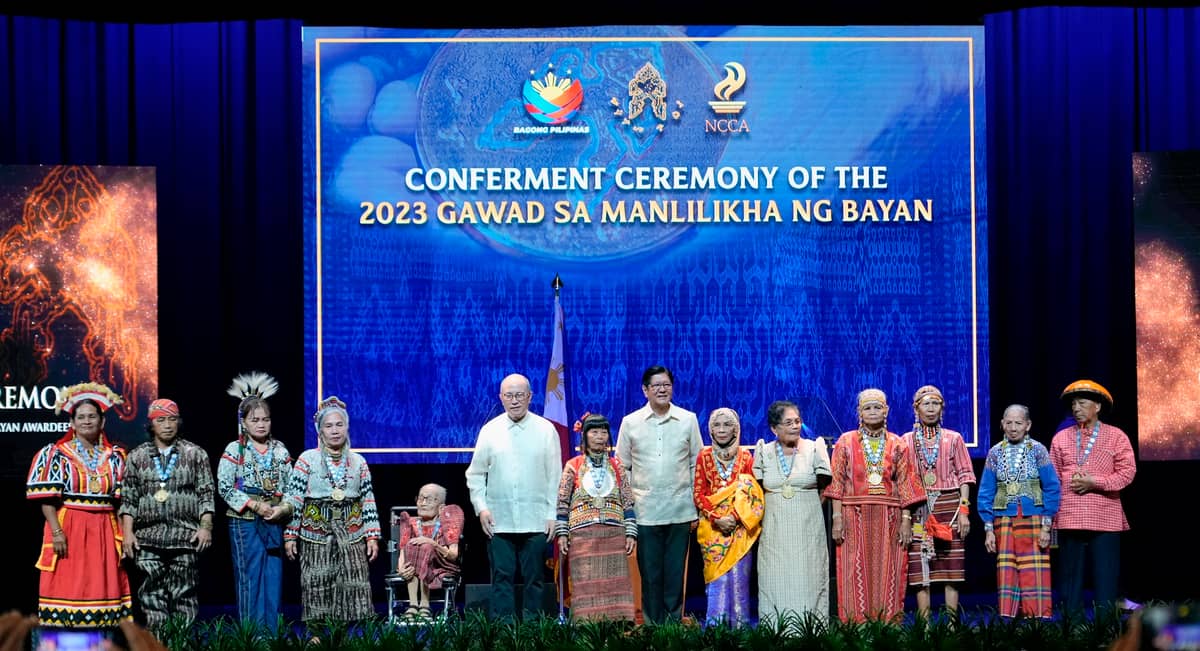 The Manlilikha ng Bayan — nine newly declared honorees and three past awardees — with President Ferdinand 'Bongbong' Marcos Jr.  and NCCA chairman Victorino Manalo.