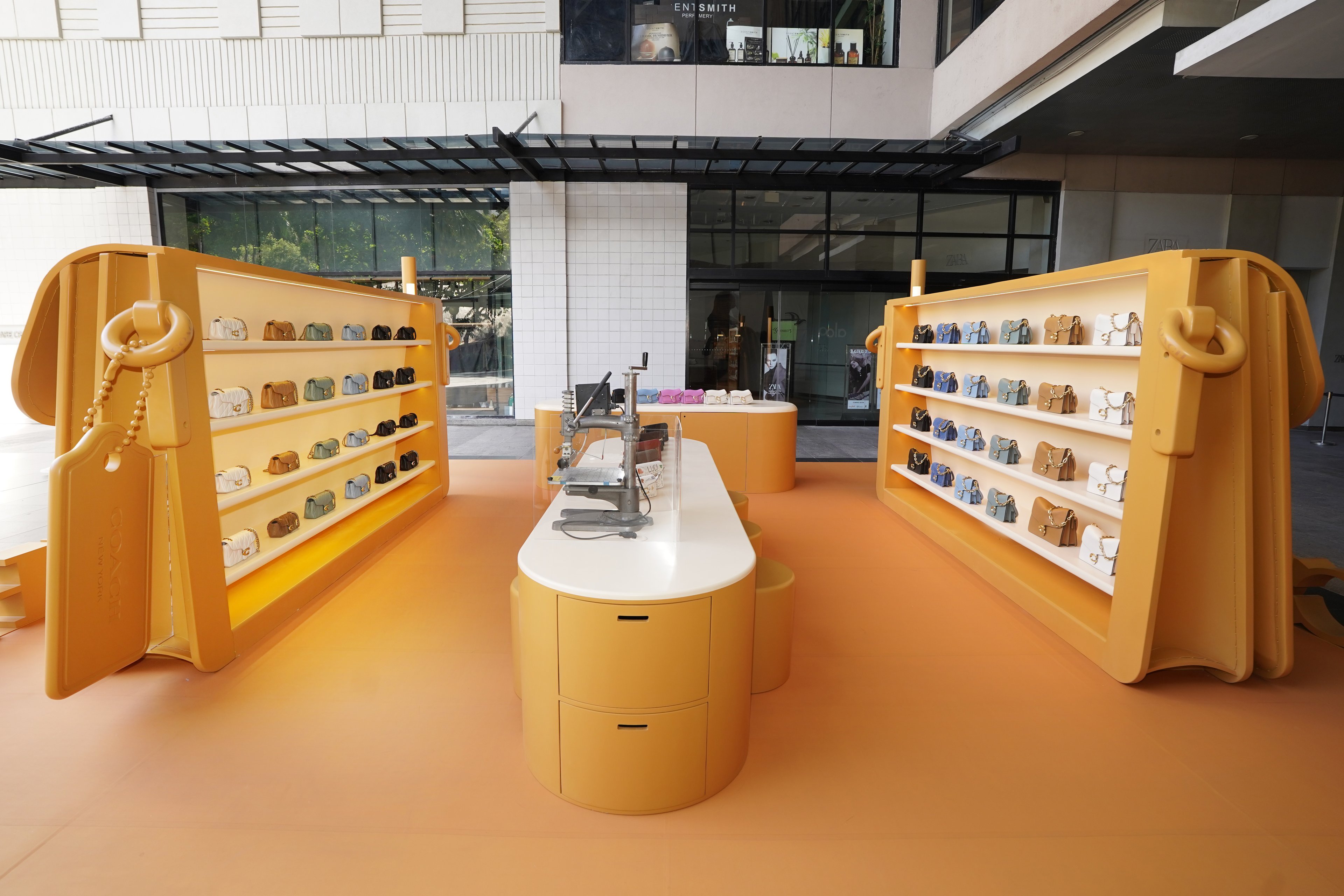 The immersive pop-up features a larger-than-life Tabby bag installation.