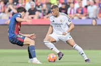 Kylian Mbappe attacks the defense to lead Barcelona to a thrilling 4-3 victory over Real Madrid in the La Liga on Sunday.