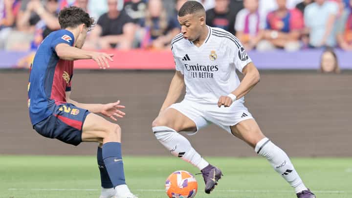 Kylian Mbappe attacks the defense to lead Barcelona to a thrilling 4-3 victory over Real Madrid in the La Liga on Sunday.
