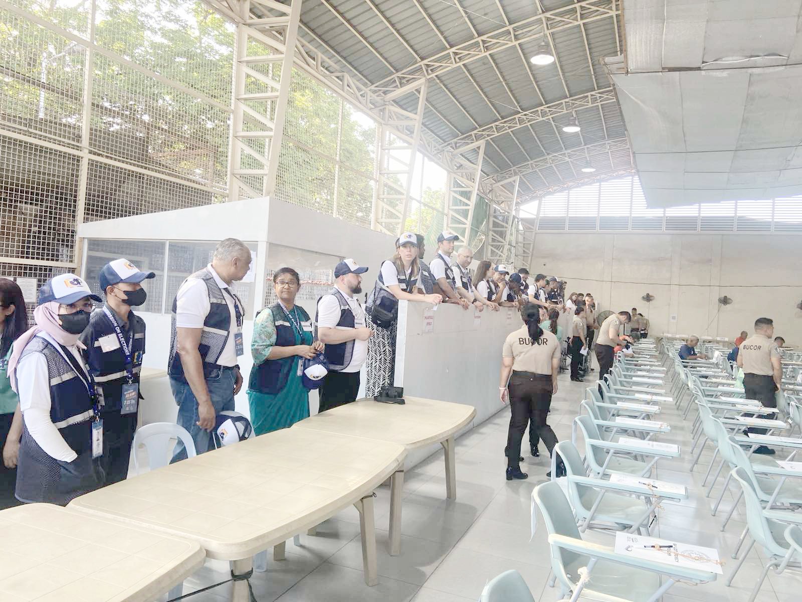 Foreign observers arrive at the New Bilibid Prison in Muntinlupa on Monday to monitor the penitentiary’s special polling precinct. Data from the Bureau of Corrections shows 4,125 persons deprived of liberty are eligible to vote.