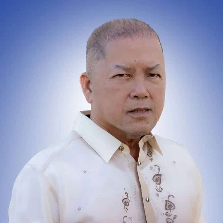 Portrait of Antonio “Tony” Kho wearing a barong Tagalog against a blue gradient background.