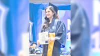 Bella Belen beams with pride after earning her Psychology degree at NU.