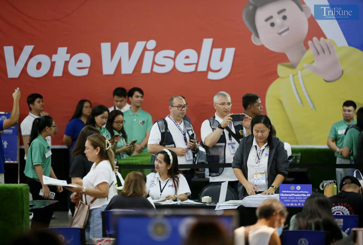 Foreign observers arrive at SM North Edsa in Quezon City on Monday, 12 May 2025, to observe voters casting their ballots during the National and Local Elections.