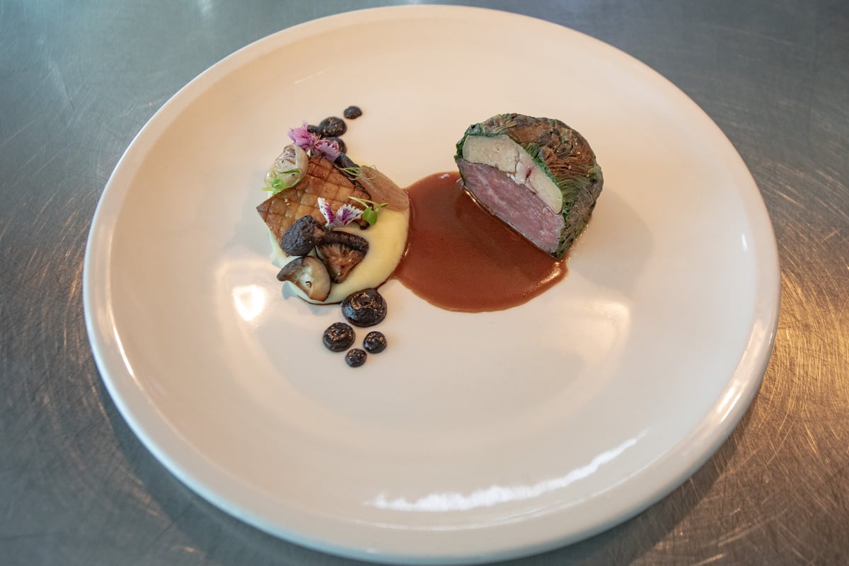 A riff on Bistek FIlipino using USDA beef, foie gras, bok choy, potato purée and fermented black garlic.