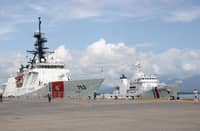 THE United States Coast Guard Cutter (USCGC) Stratton (WMSL-752) docks beside a Philippine Coast Guard vessel as it receives arrival honors during its port visit to Puerto Princesa on Saturday.