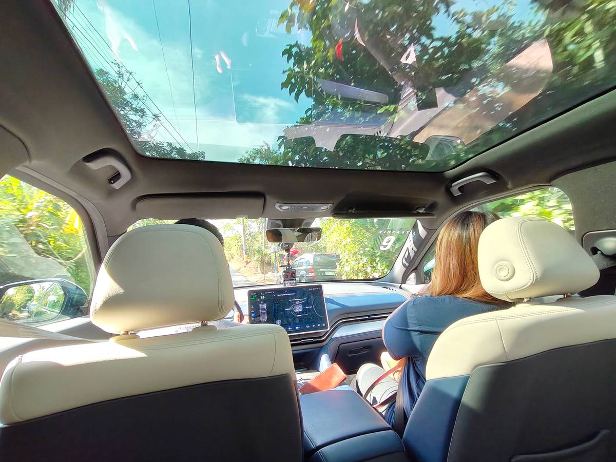 THE view from the VF 9 shows a roomy cabin, tech at your fingertips and sunlight pouring through a panoramic roof.