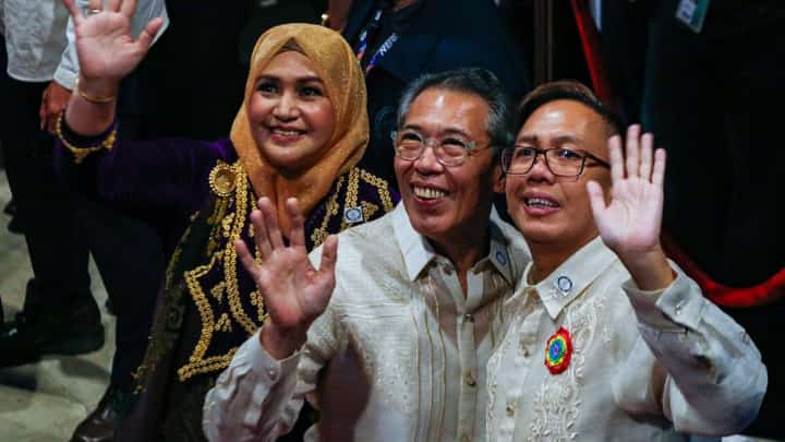 TOPNOTCHERS: Newly-proclaimed representatives from vote-leading party-list Akbayan, led by Chel Diokno, wave at Manila Hotel on Monday.