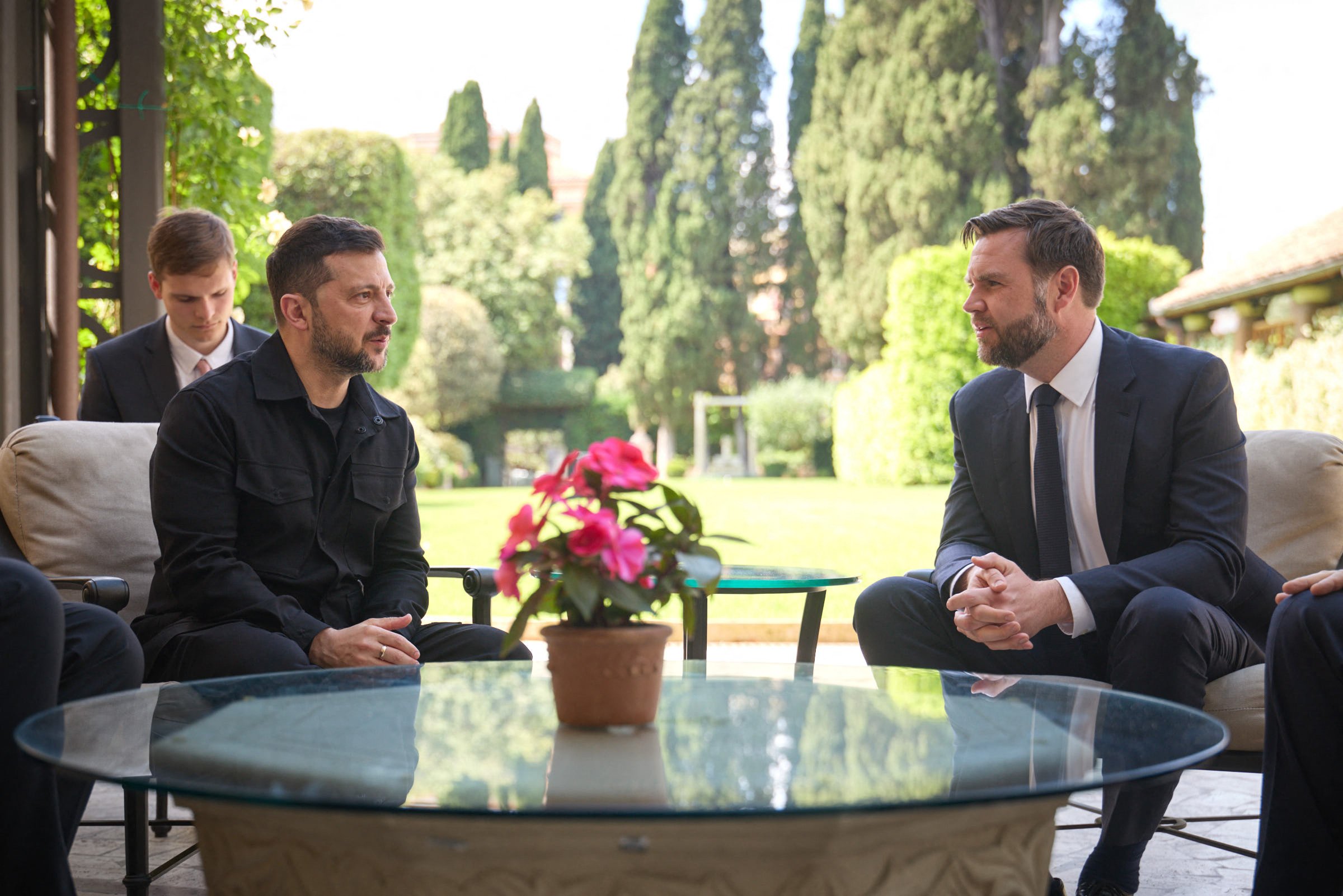 This handout photograph taken and released by Ukrainian Presidential press-service shows the President Volodymyr Zelensky and Vice President of the United States JD Vance talking during their meeting in Rome.