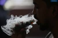 (May 19 2025) A man blow thick smoke from vape on Monday May 19 2025, Senate President vape tax adjustment to be approved when senate returns to session. Photo/Analy Labor
