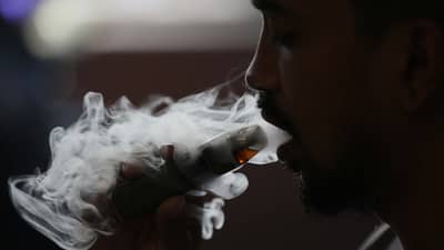 (May 19 2025) A man blow thick smoke from vape on Monday May 19 2025, Senate President vape tax adjustment to be approved when senate returns to session. Photo/Analy Labor
