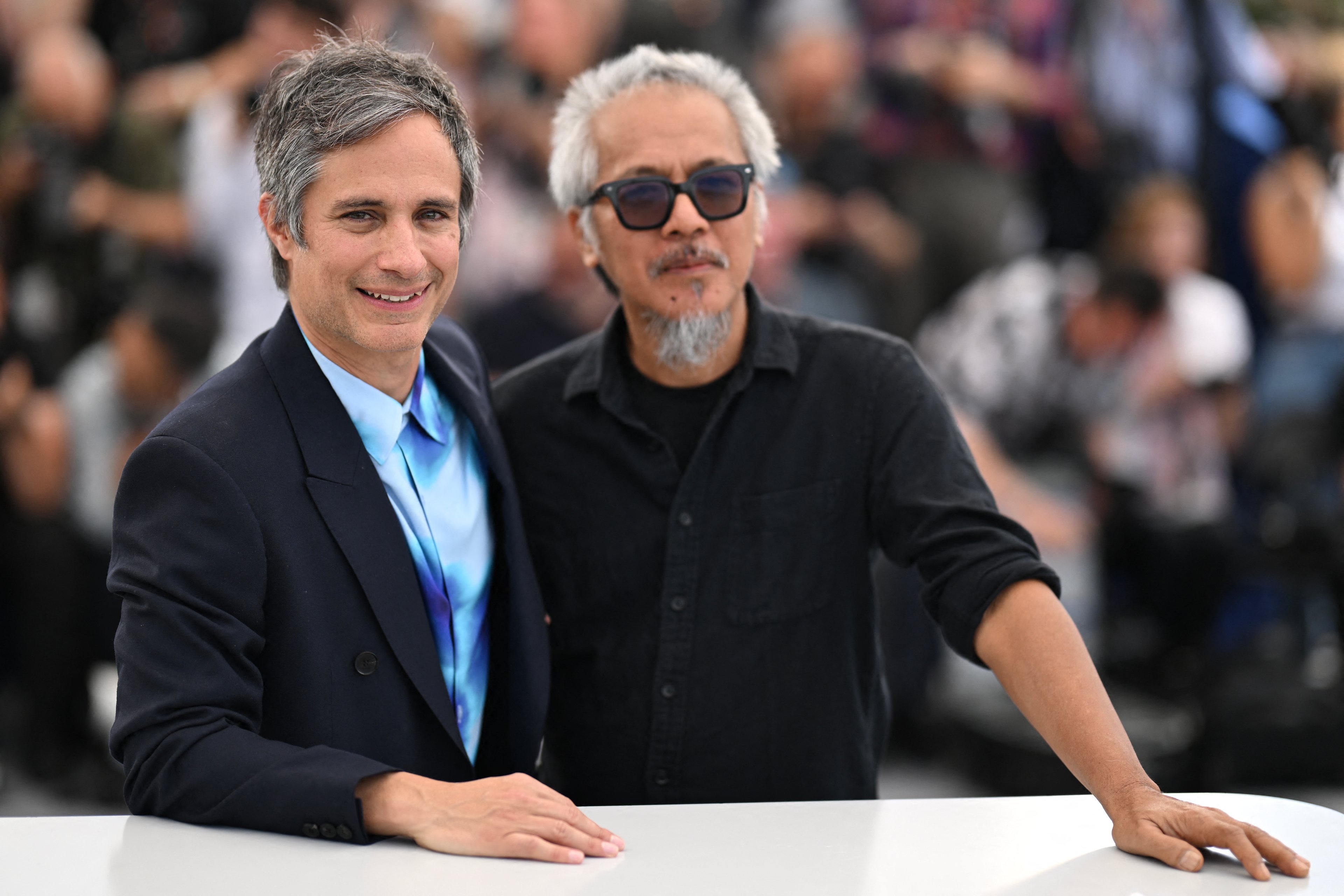 Mexican actor Gael Garcia Bernal (left) and Filipino director, screenwriter and cinematographer Lav Diaz at the 78th edition of the Cannes Film Festival in Cannes, southern France.