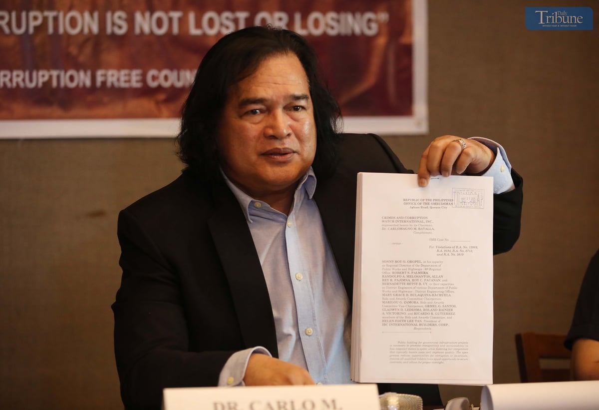 On Wednesday, 21 May 2025, during a press conference in Quezon City, Dr. Carlo Batalla, chairman of Crimes and Corruption Watch International, presents documents his group filed before the Office of the Ombudsman against top officials of the Department of Public Works and Highways–Region 6 and executives of a private construction firm over alleged irregularities involving P2.4 billion in bidding contracts.
