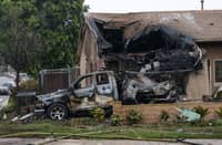 A home is partially destroyed and a vehicle burned out after a small plane crashed into a residential street in San Diego, California, on 22 May 2025. The Cessna 550, en route to Montgomery-Gibbs Executive Airport, went down around 3:45 a.m., leaving behind a large debris field and damaging at least 15 homes and cars, according to local officials.