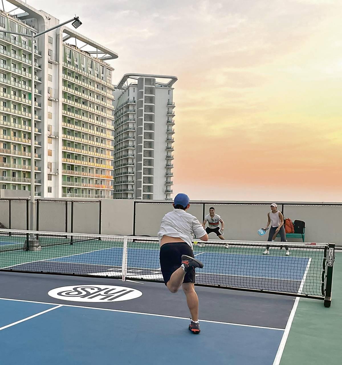 Intense pickleball match underway at SM City Bicutan’s court.