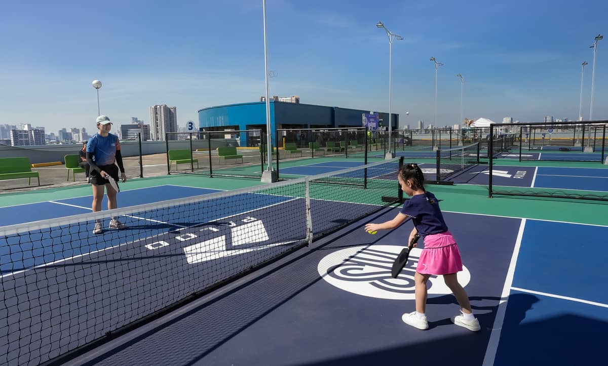 Pickleball enthusiasts engage in a friendly game 
at SM City Sta. Mesa.