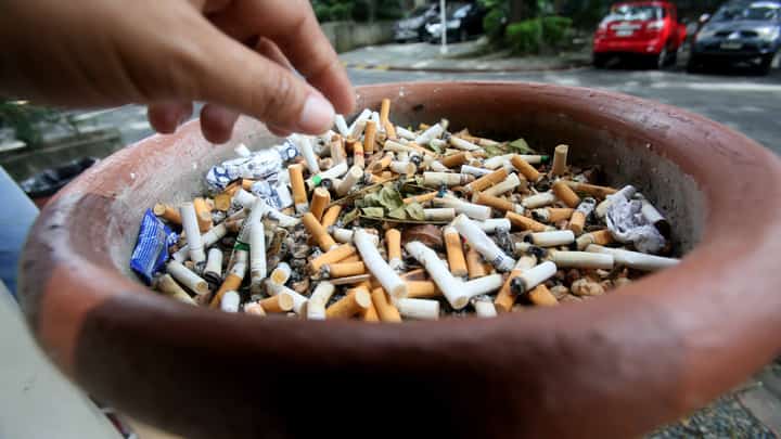 AN overflowing cigarette bin at a designated smoking area in the University of the Philippines Diliman, Quezon City.