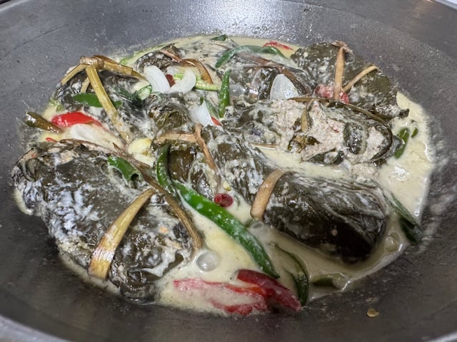 Wrapped in gabi leaves, filled with grated coconut and shrimp, then simmered in rich coconut milk — Tinuktok is a true Bicolano delicacy that brings comfort in every creamy, spicy bite.