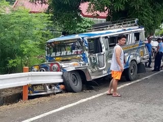 Passenger jeep collides with road barrier in Boac