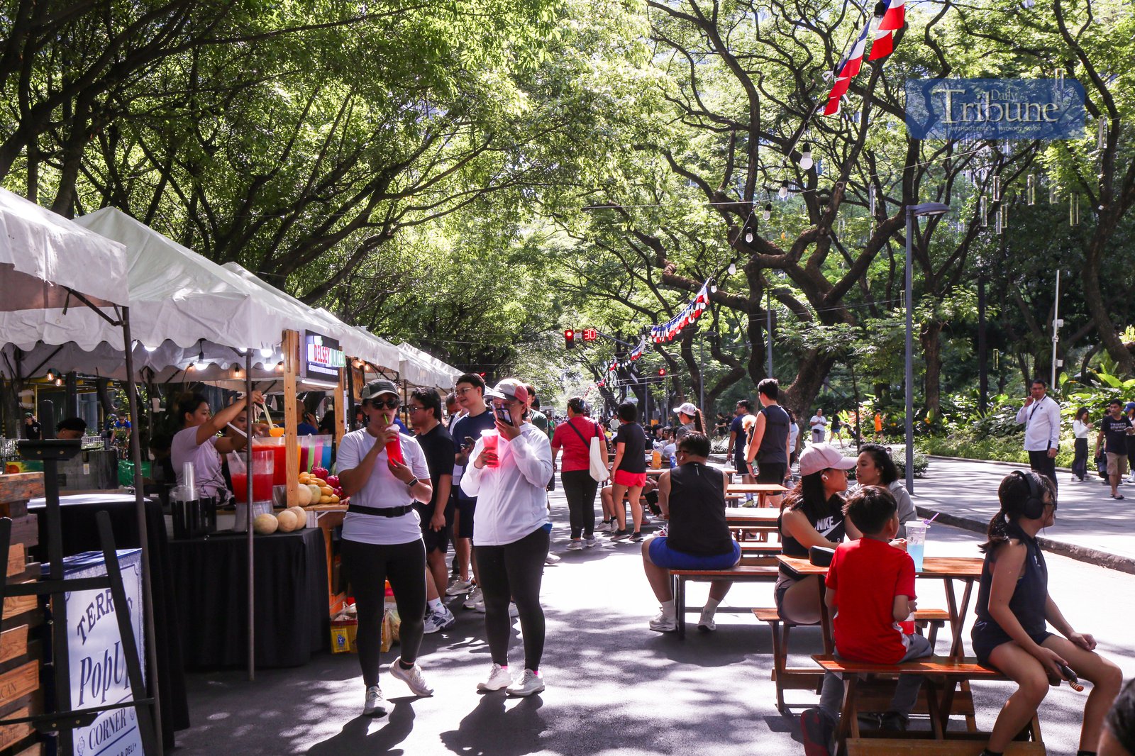 Visitors explore food and beverage stalls along Paseo de Roxas in Makati City during the Makati Street Meet presents Goût de France on the morning of 25 May 2025. The event offers a taste of French cuisine, drinks, and culture in the heart of the city.