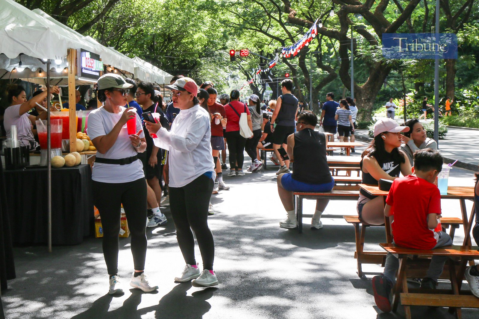 Visitors explore food and beverage stalls along Paseo de Roxas in Makati City during the Makati Street Meet presents Goût de France on the morning of 25 May 2025. The event offers a taste of French cuisine, drinks, and culture in the heart of the city.