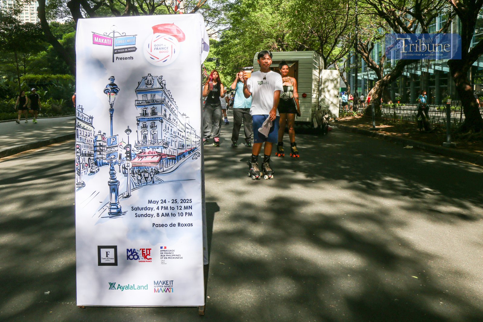 Visitors explore food and beverage stalls along Paseo de Roxas in Makati City during the Makati Street Meet presents Goût de France on the morning of 25 May 2025. The event offers a taste of French cuisine, drinks, and culture in the heart of the city.