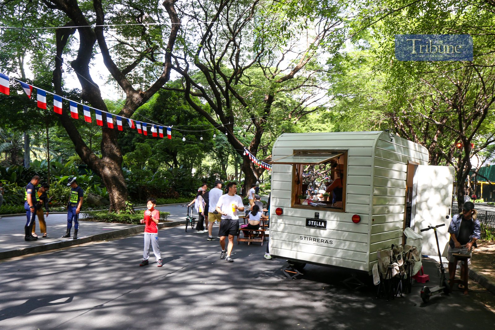 Visitors explore food and beverage stalls along Paseo de Roxas in Makati City during the Makati Street Meet presents Goût de France on the morning of 25 May 2025. The event offers a taste of French cuisine, drinks, and culture in the heart of the city.