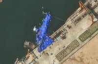 This handout satellite image courtesy of Maxar Technologies taken on 23 May 2025, shows a general view of a new North Korean warship at the harbor after its launch accident in Chongjin. North Korea has begun an investigation into the accident that occurred during the 21 May 2025, launch, state media said on 23 May 2025, assessing the damage as "not serious".
