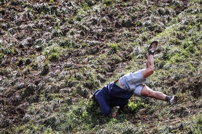 What drives people to chase cheese down a hill? Welcome to Cooper’s Hill