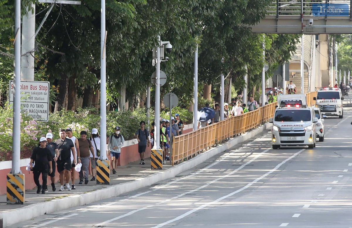 SLOW moving traffic along EDSA marks the first day of "EDSA Walk".