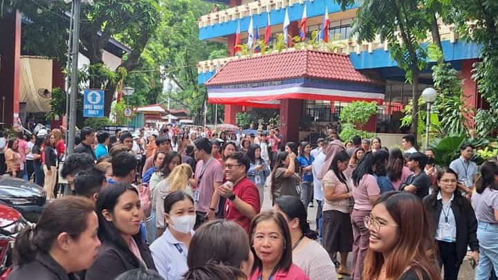 DSWD personnel evacuate to the open grounds of the agency’s Central Office following an earthquake felt across Metro Manila on Tuesday, 27 May.