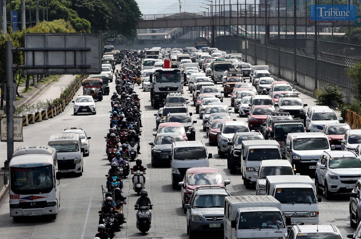 ALL in a row: Motorcycle riders are seen staying in their lane along Guadalupe as NCAP (No Contact Apprehension Program) takes effect. Photo for the DAILY TRIBUNE by Analy Labor