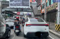 A hybrid vehicle obstructs the bike lane along EDSA-Cubao near Aurora Boulevard in Quezon City on Thursday, 29 May 2025, the fourth day of the "No Contact Apprehension Policy" implementation. Despite being exempt from the number coding scheme during the EDSA rehabilitation, hybrid and electric vehicles remain subject to regular traffic violations.