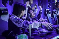 KarlTzy raises hands in victory