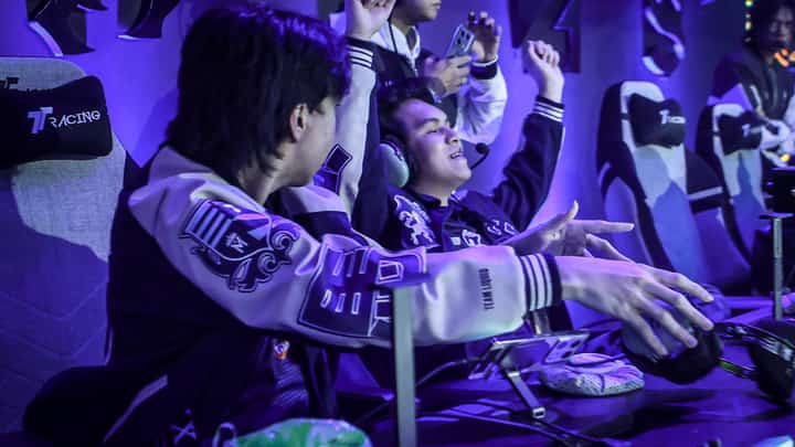 KarlTzy raises hands in victory