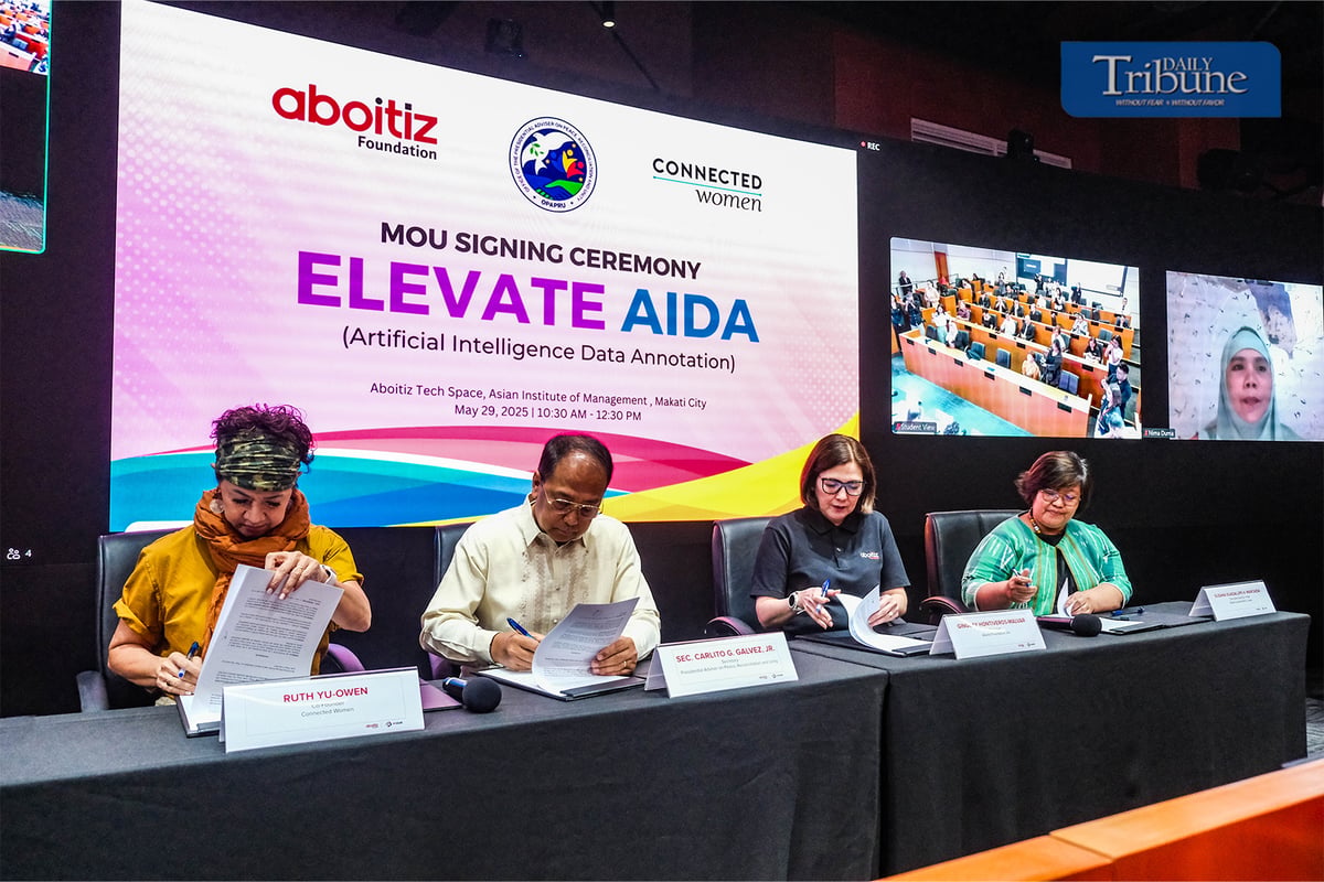 ABOITIZ Foundation president Ginggay Hontiveros-Malvar (2nd from right) and OPAPRU head and presidential peace adviser Carlito G. Galvez Jr. sign the memorandum of understanding on the Elevate AIDA program at the Aboitiz TechSpace of Asian Institute of Management in Makati City on 29 May 2025. Signing as witnesses are Connected Women co-founder Ruth Yu-Owen (left) and OPAPRU Office for Peace Sustainability executive director Susana Guadalupe Marcaida.