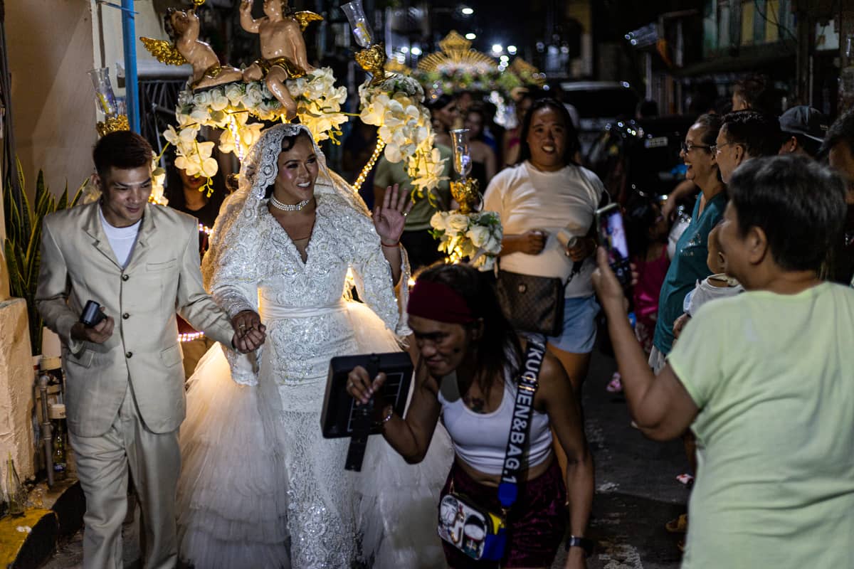 Gay Reynas interact with spectators during the Sagayla procession in Sampaloc, Manila on Sunday, 1 June 2025.
