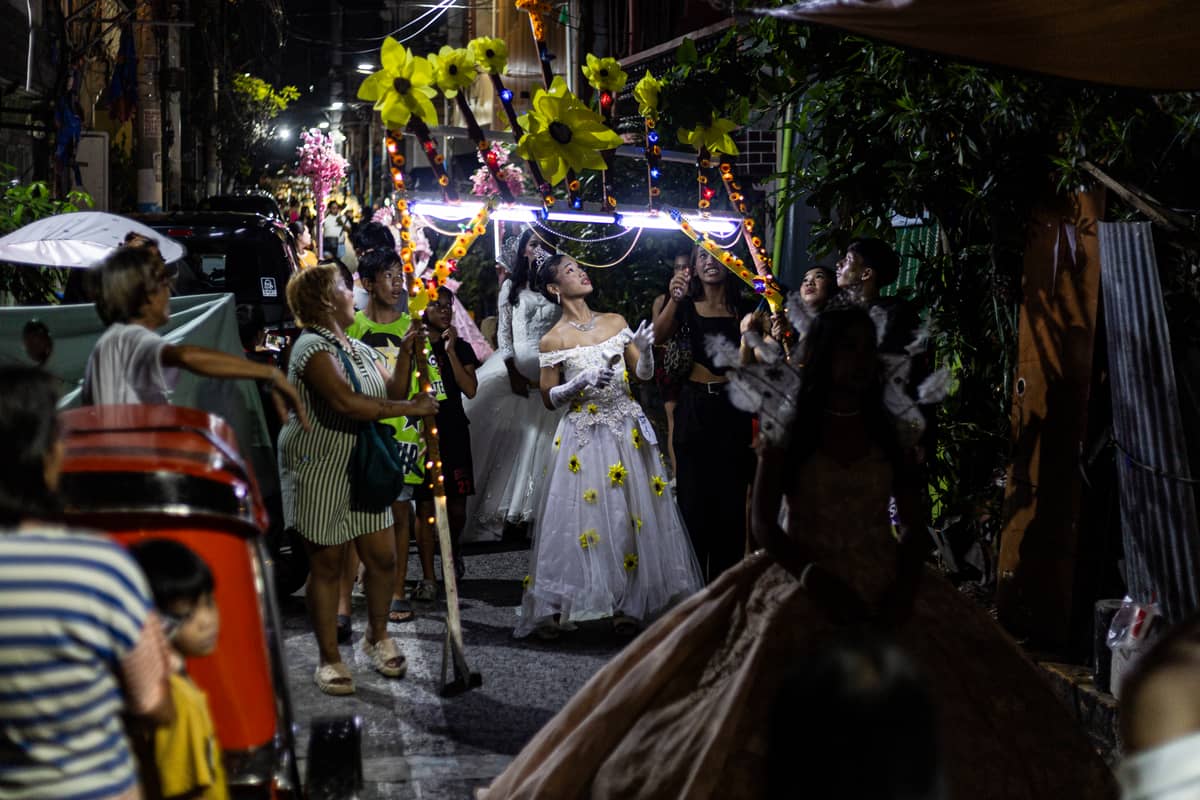 Gay Reynas interact with spectators during the Sagayla procession in Sampaloc, Manila on Sunday, 1 June 2025.