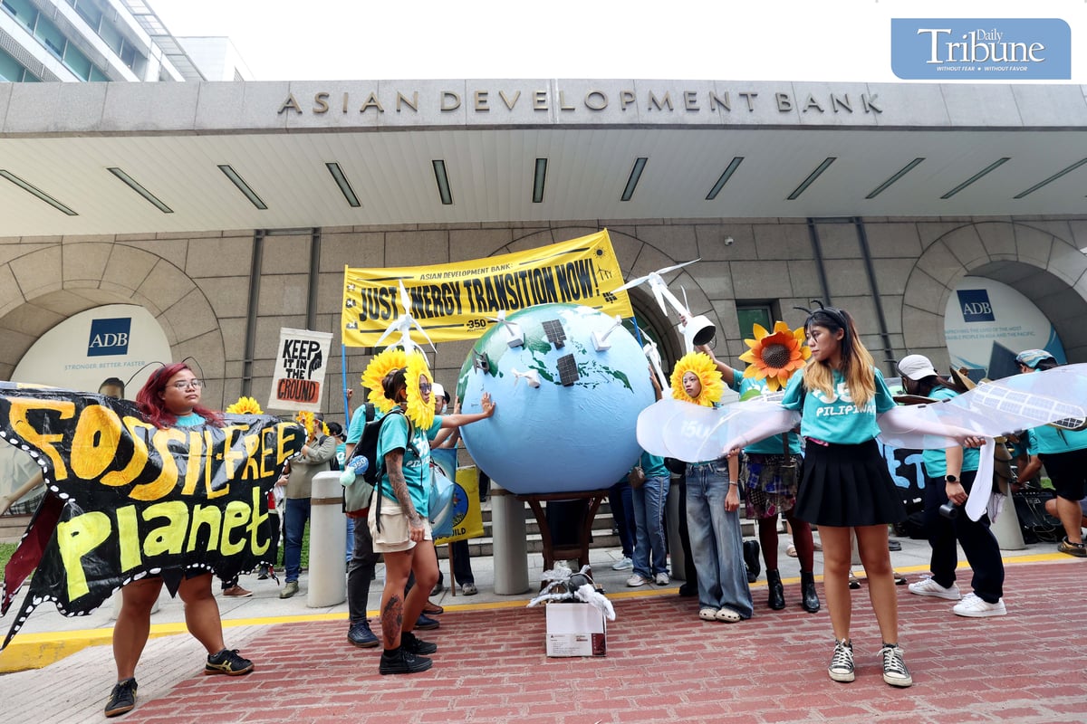 Environmental group 350 Pilipinas staged a creative protest outside the Asian Development Bank headquarters in Mandaluyong City on Thursday, calling for a just energy transition rooted in community-led solutions.