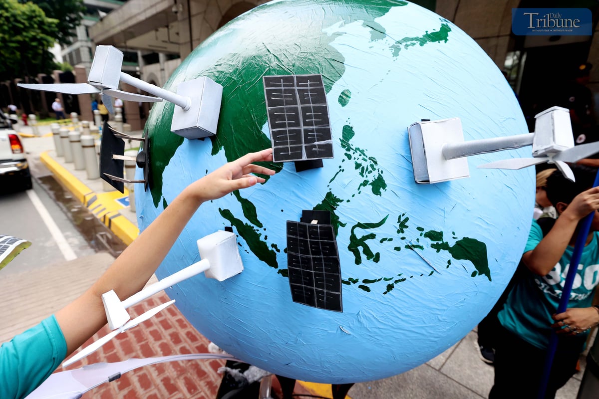 Environmental group 350 Pilipinas staged a creative protest outside the Asian Development Bank headquarters in Mandaluyong City on Thursday, calling for a just energy transition rooted in community-led solutions.