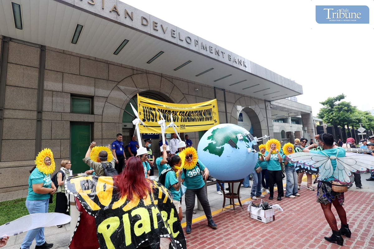 Environmental group 350 Pilipinas staged a creative protest outside the Asian Development Bank headquarters in Mandaluyong City on Thursday, calling for a just energy transition rooted in community-led solutions.