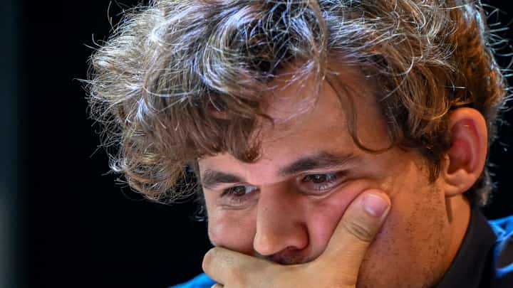 Norway's chess grandmaster Magnus Carlsen gestures during a game in the Tata Steel Chess India tournament in Kolkata on 17 November 2024.