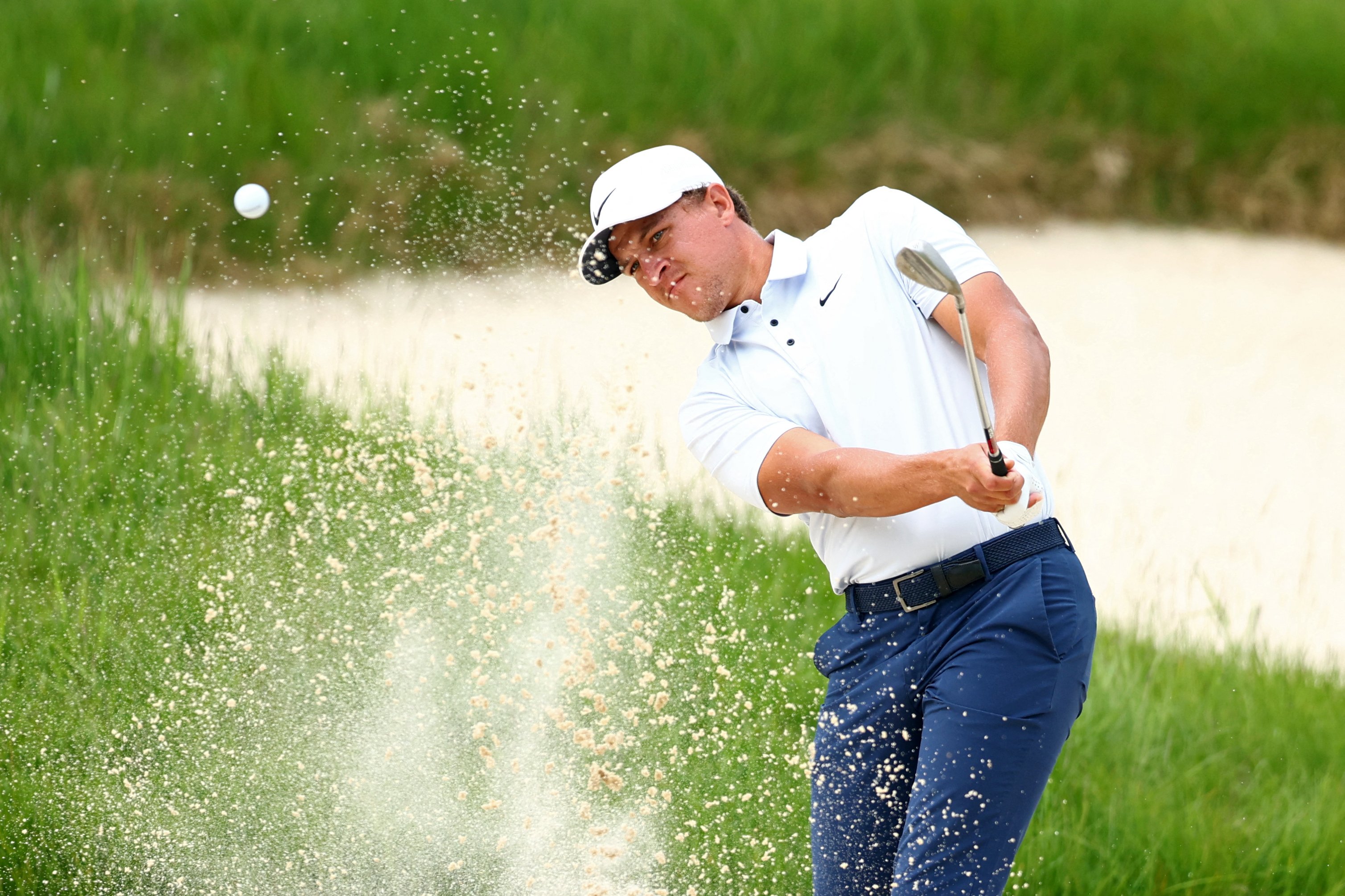 Champ takes charge; McIlroy crashes out