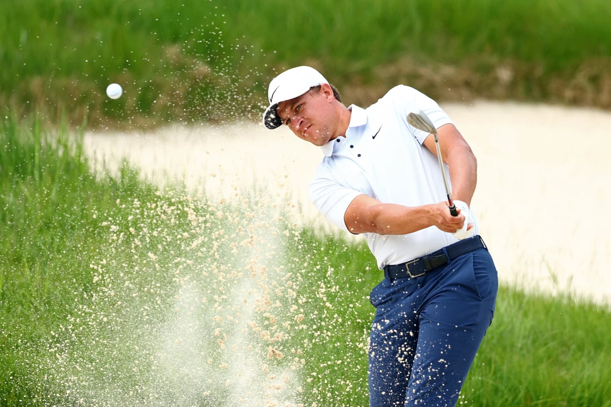 Champ takes charge; McIlroy crashes out