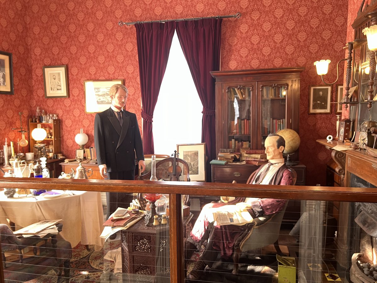 Figures of the detective and his sidekick Dr. John Watson in the living room.
