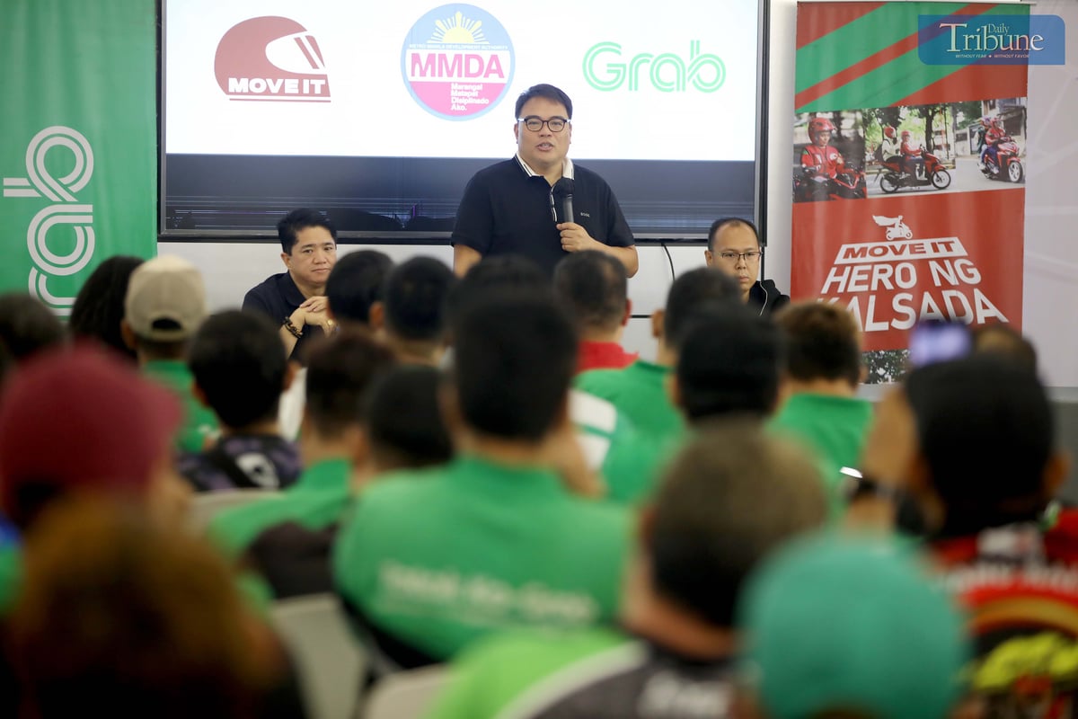 Metropolitan Manila Development Authority Chairman Don Artes, along with Traffic Discipline Office head Victor Nuñez and Special Operations Group Strike Force head Gabriel Go, speaks with MOVE IT and Grab drivers about the NCAP rules during a forum at the Asenso Center on A. Bonifacio Avenue, Barangka, Marikina City, on Saturday.